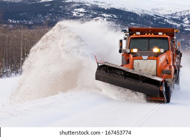 Snow Plough Truck Clearing Road After Whiteout Winter Snowstorm Blizzard For Vehicle Access