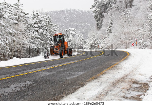 The snow plow cleans the mountain road from snow.\
Uludag National Park. Bursa