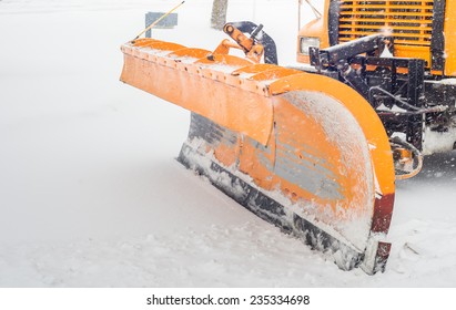 Snow plow doing snow removal after a blizzard in Chicago suberb. - Powered by Shutterstock