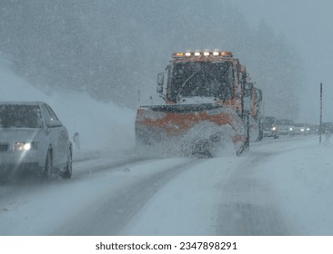 snow plow on a country road, traffic and mobility in winter - Powered by Shutterstock