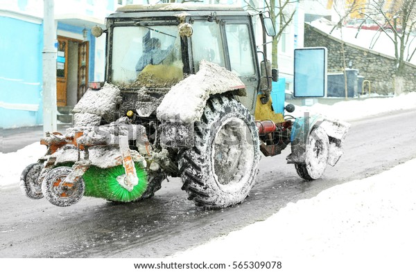 Snow plow outdoors cleaning\
street