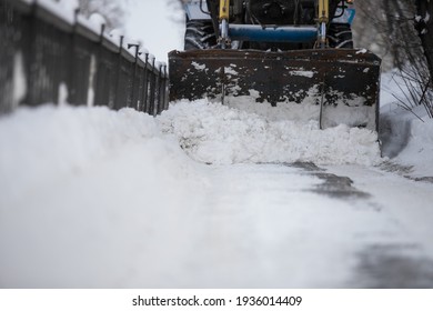 Snow Plow And Snow Truck Cleaning The Streets During A Snow Storm In Night Maintenance Action In Belgrade, Serbia