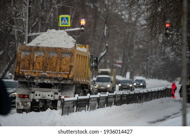 Snow Plow And Snow Truck Cleaning The Streets During A Snow Storm In Night Maintenance Action In Belgrade, Serbia