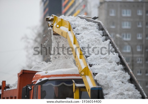 Snow plow
and snow truck cleaning the streets during a snow storm in night
maintenance action in Belgrade,
Serbia