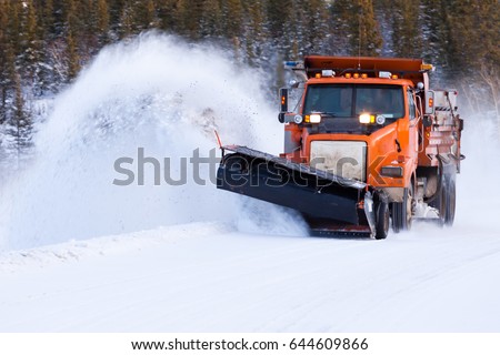 Snow plow truck clearing road after winter snowstorm blizzard for vehicle access Foto d'archivio © 