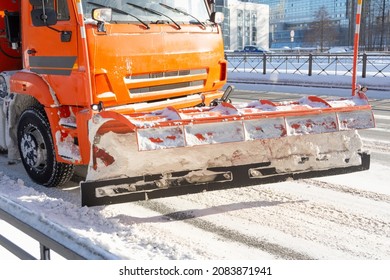 Snow Plow Truck On Road Pushing The Snow On The Side