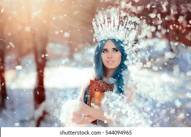 Snow Queen Holding Mirror in Winter Fantasy - Beautiful princess with ice crown and blue hair
