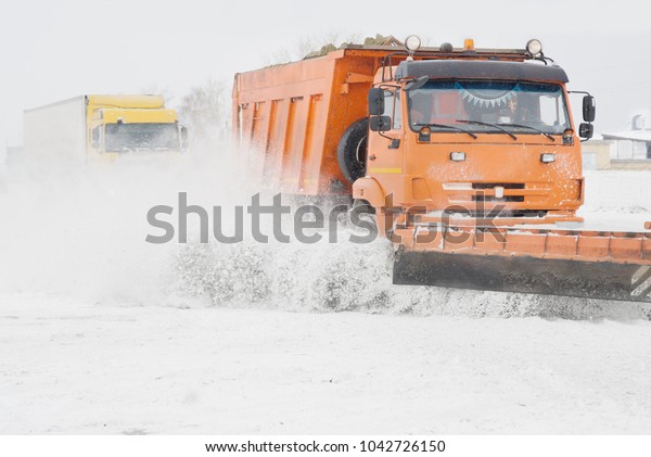 Snow removal in\
snowfall.