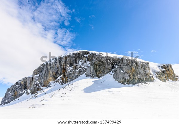 Snow\
rocks of the Half Moon Island, an Antarctic island, the South\
Shetland Islands of the Antarctic Peninsula\
region.