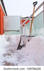 Snow Shovel On The Balcony After Winter Snowfall