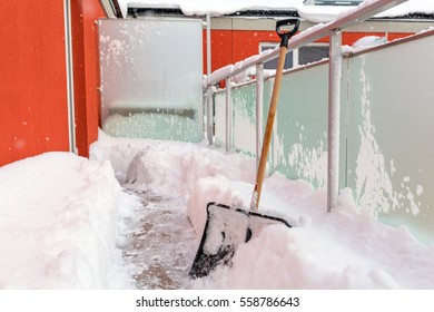 Snow Shovel On The Balcony After Winter Snowfall