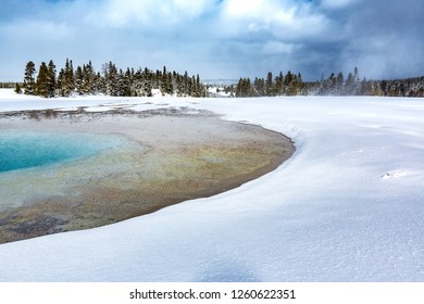Snow surrounds heated thermal pool in Yellowstone