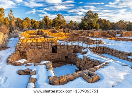 Snow surrounds the remains of mesa top Coyote Village on Chapin Mesa in Mesa Verde National Park, Colorado.