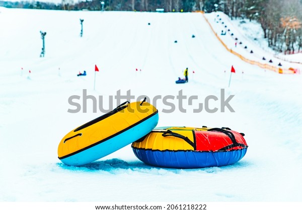 snow tubing rings close up. hill on background.\
winter family leisure