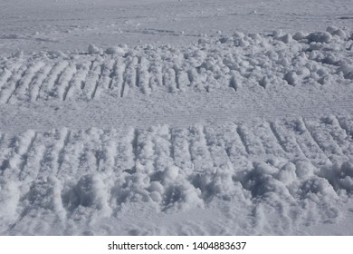 Snow vehicle tracks in the snow