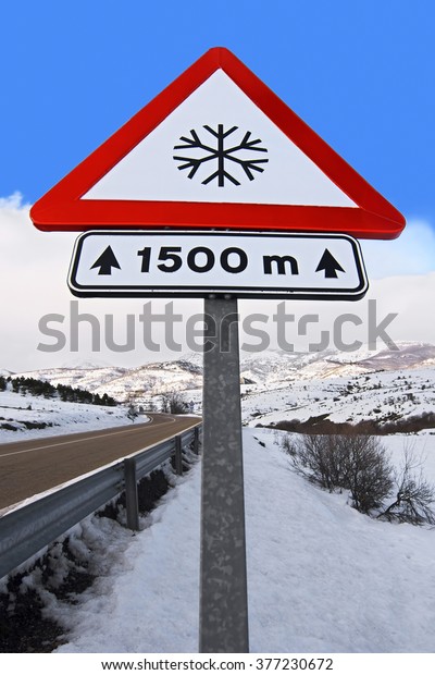  snow\
warning caution sign in highway of\
mountain