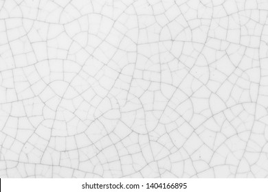 Snow white crack ceramic tile.  Winter color of glazed tile texture abstract background.