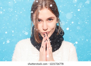 snow, winter, christmas, healthy lifestyle, happiness and people concept - The young woman's portrait with happy emotions. Laughing, smiling, anger, suspicion, fear, surprise over snow background - Shutterstock ID 1221726778