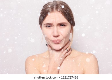 snow, winter, christmas, Illness, Health Care, people, Medicine concept - Throat Pain. Closeup Of Sick Woman With Sore Throat Feeling Bad. Beautiful Girl Touching Neck With Hand over snow background - Shutterstock ID 1221727486
