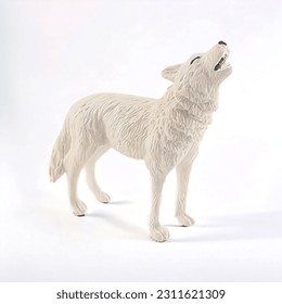 Snow wolf animal miniature toy on white background - Shutterstock ID 2311621309