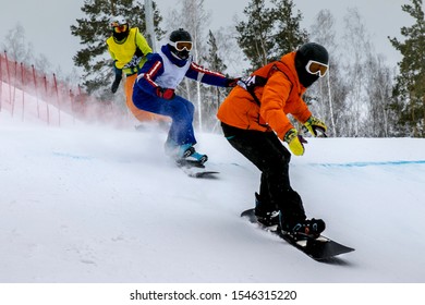 snowboard cross group of man athletes race down a course
