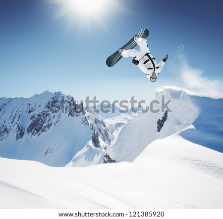 Snowboard Jumping in high mountains