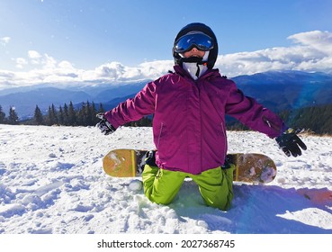 Snowboard Winter Sport. Little Kid Girl Playing With Snow Wearing Warm Winter Clothes. Winter Background