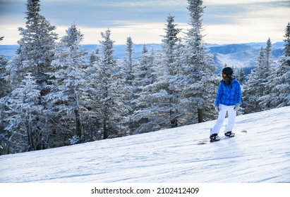 Snowboarder Enjoys The Stowe Mountain Resort.