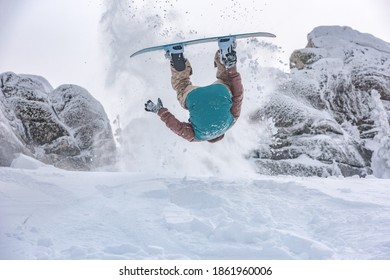 Snowboarder Makes Dangerous Trick With Jump And Flip In Powder Snow