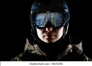 Snowboarder In The Mask And Helmet On A Black Background