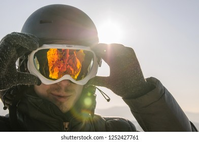 Snowboarder In Mask On Top