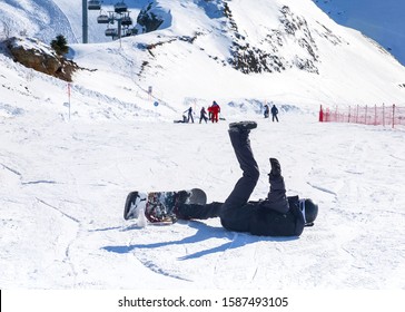 Snowboarder On The Ski Run. Fall Of A Snowboarder