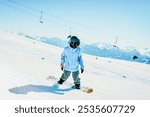 Snowboarder ride downhill motion freeze with mountains background. Free riding alps europe snowy destinations