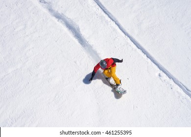 Snowboarder Riding On Loose Snow Freeride Top View.