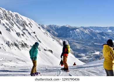 Snowboarders At Summit Of Big Sky Ski Resort In Montana