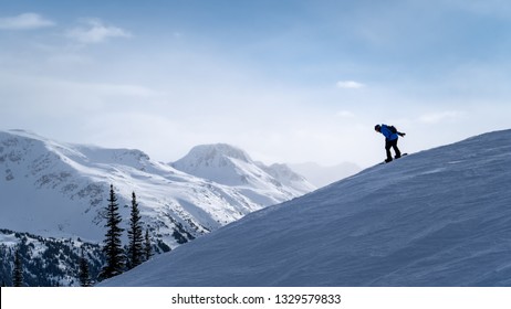 Snowboarding along a ridge line in Whistler