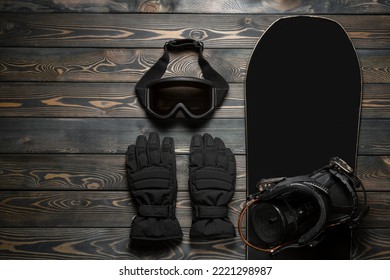 Snowboarding equipment on the wooden flat lay background with copy space. - Shutterstock ID 2221298987