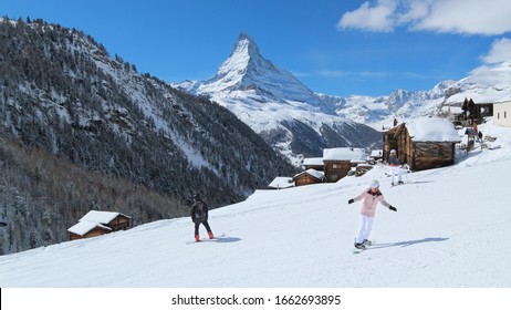 Snowboarding In Zermatt, Switzerland. The Matterhorn. Swiss Alps Winter.