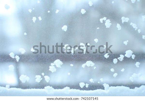 Snowbound window close-up, indoor.
Seasonal winter weather conditions. Snowy winter
background.