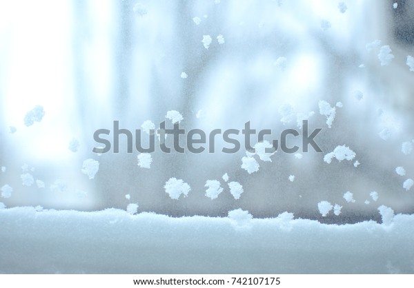 Snowbound window close-up, indoor.
Seasonal winter weather conditions. Snowy winter
background.