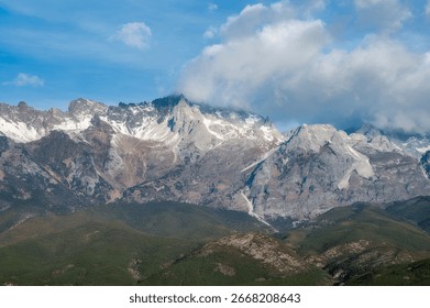Snowcapped Mountain Range Under a Blue Sky