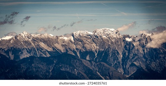 Snow-capped mountain range under a clear blue sky.