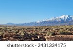 Snow-capped mountains meet the high desert at the volcanic tablelands.