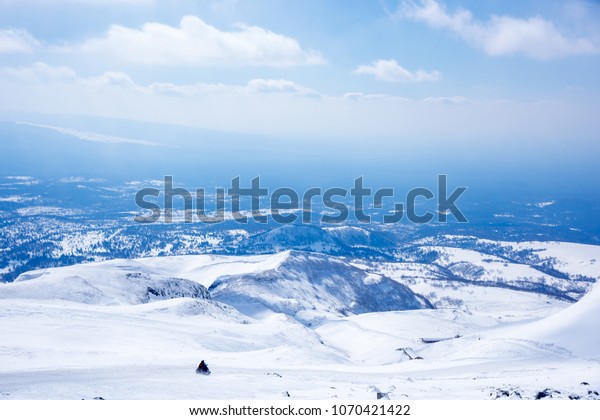 Snow-capped mountains\
overlooking the\
landscape