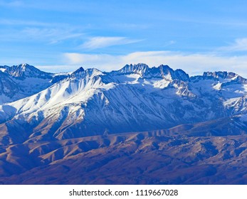 Snowcapped Palisade Crest and Middle Palisade Glacier (center) under Sunny Blue Sky, from White Mountain Road, California, November 2017