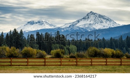 The Snowcapped Sisters Mountains in the The Cascades Mountain Range in Central Oregon During Fall Autumn