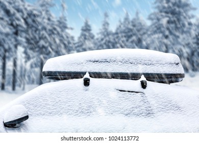 A Snow-covered Car With A Ski Rack For A Very Cold Winter Day