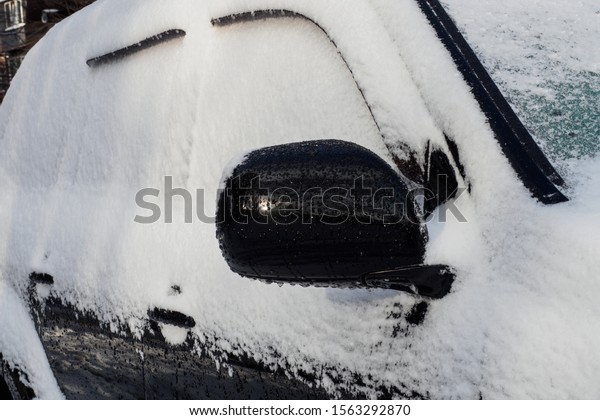 \
Snow-covered car. Winter, car in a\
snowdrift.