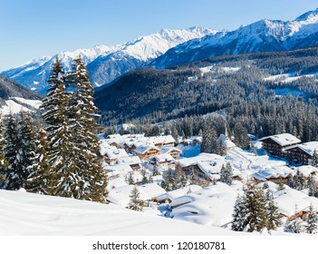 Snow-covered cottages at the Austrian Alps of the Tyrol region. Panorama