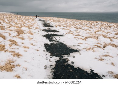 Snow-covered path to the ocean